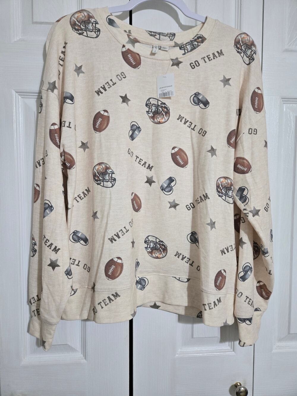 Cato medium women's football sweater new with tags